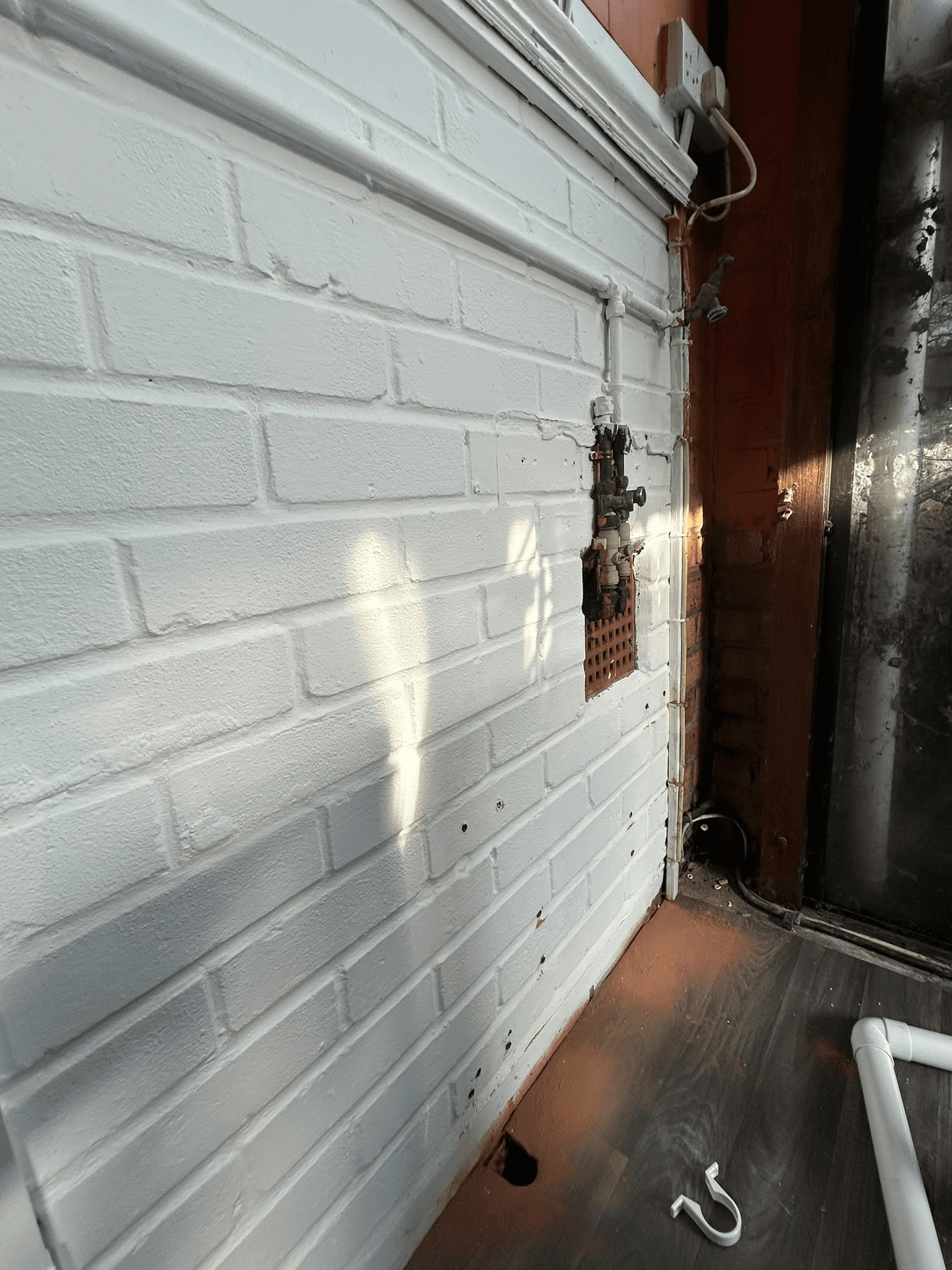 Freshly painted white brick exterior wall