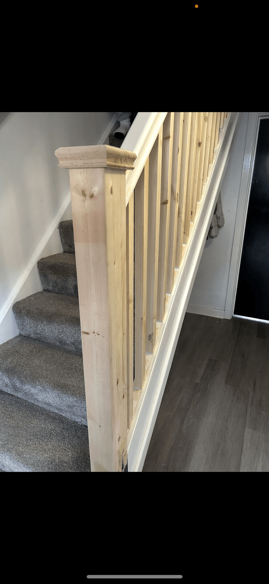 New pine staircase banister close-up