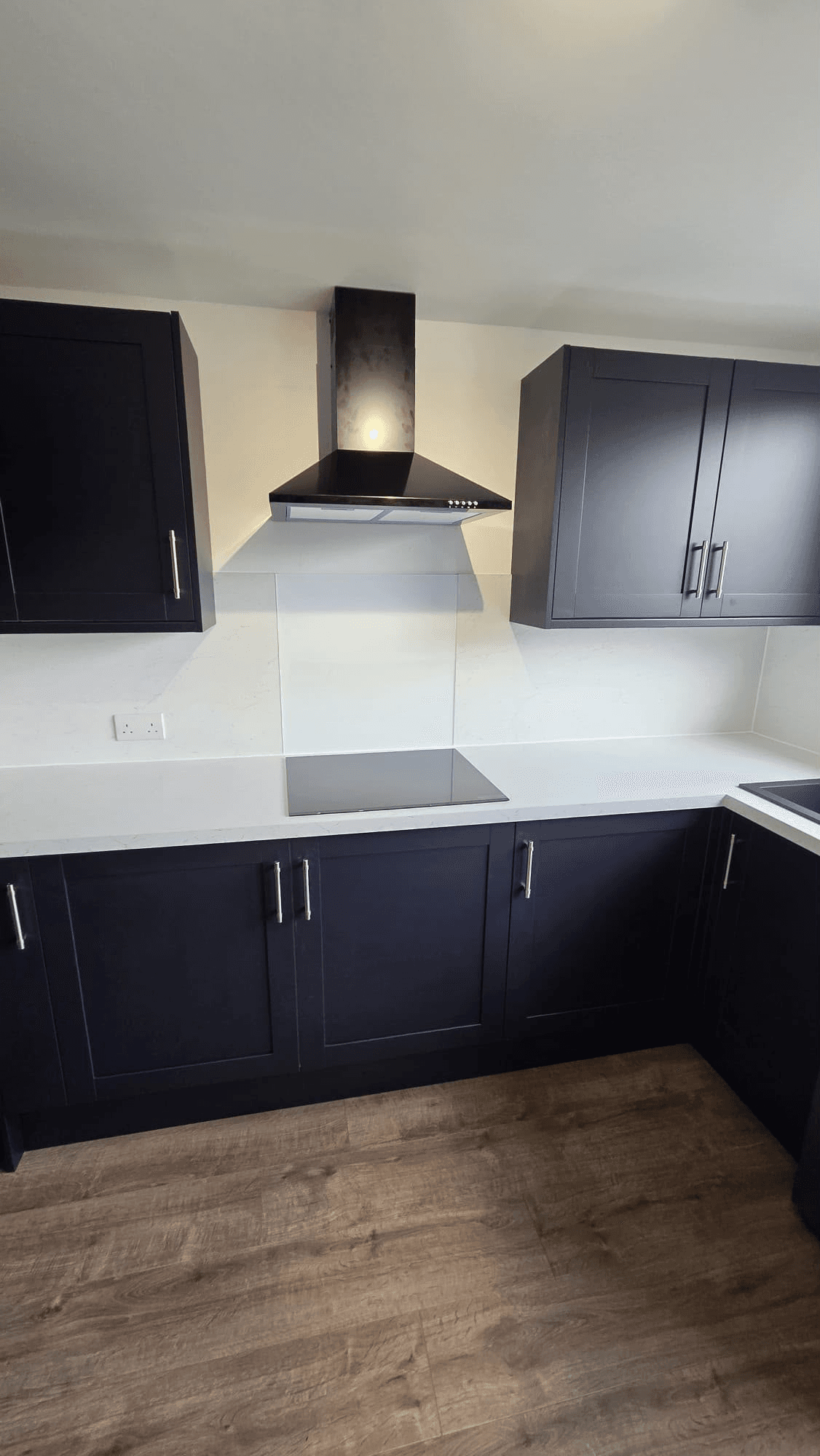 Navy shaker kitchen unit installation